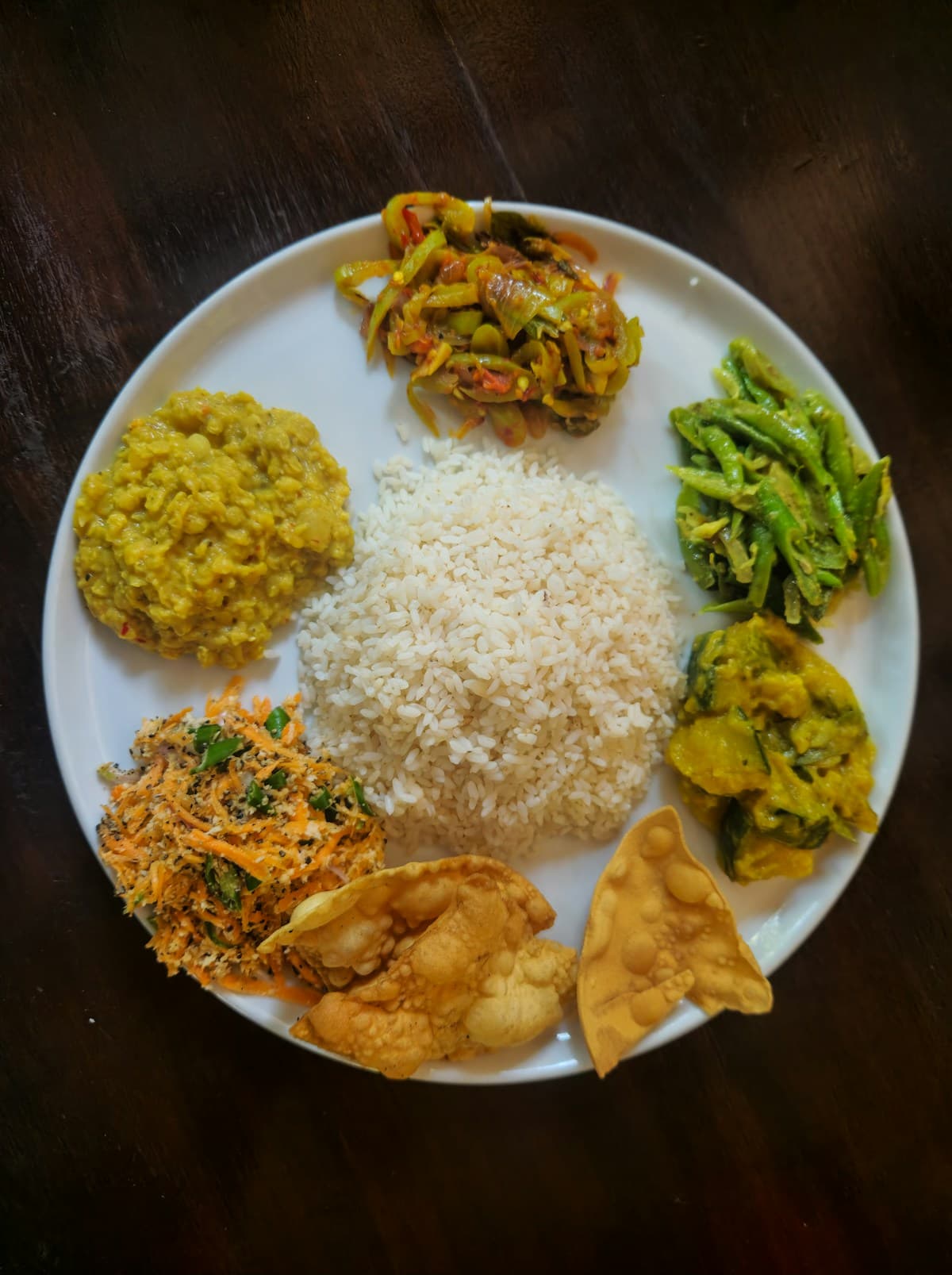Rice with dal, vegetables and curries